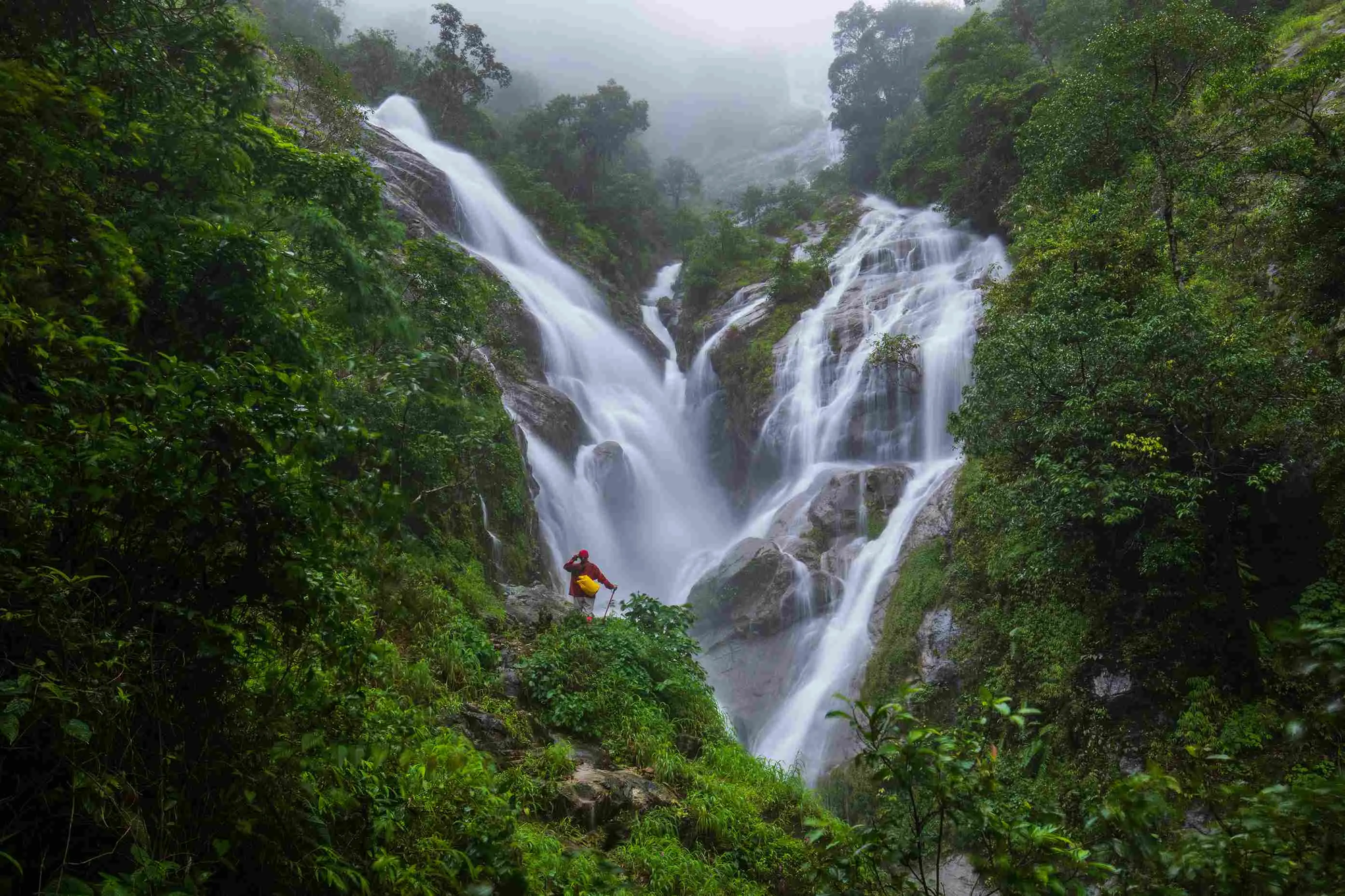 girl-red-sweater-touring-pi-tu-gro-waterfall-beautiful-waterfall-tak-province-thailand_11zon.webp