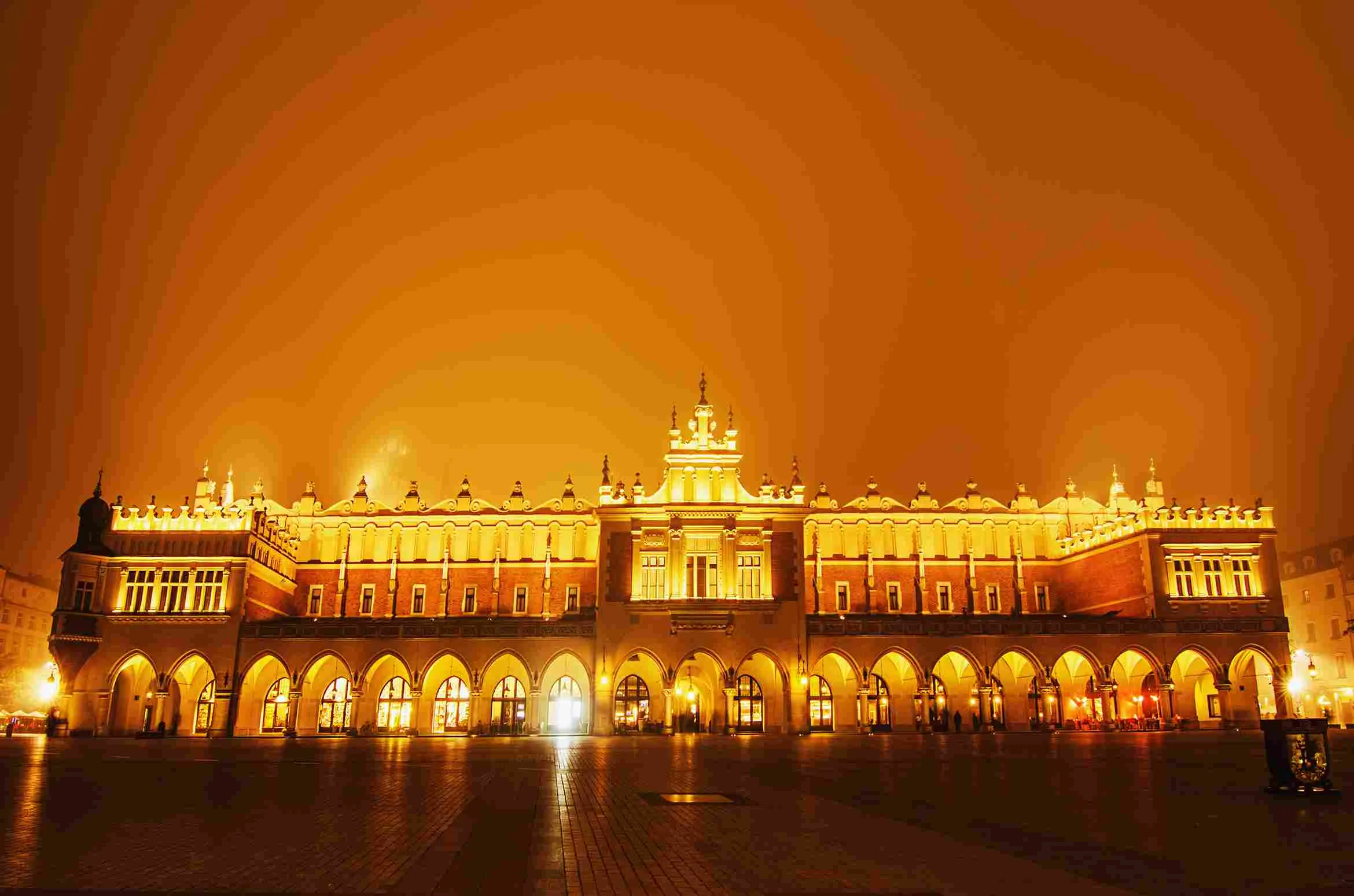 market-hall-main-cracow-square-misty-night-with-golden-sky_11zon.webp