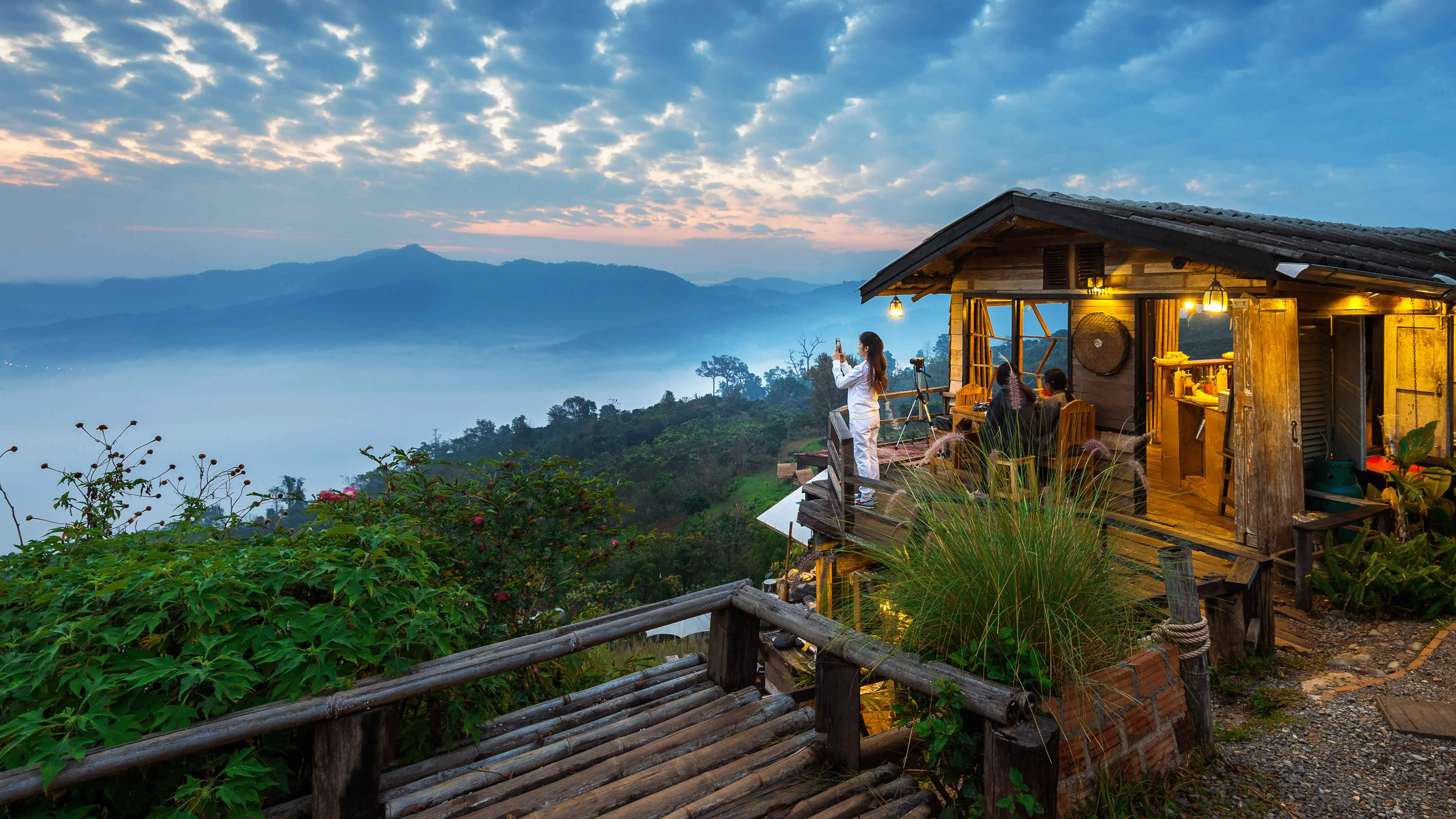 woman-taking-photo-morning-mist-phu-lang-ka-phayao-thailand_11zon.webp